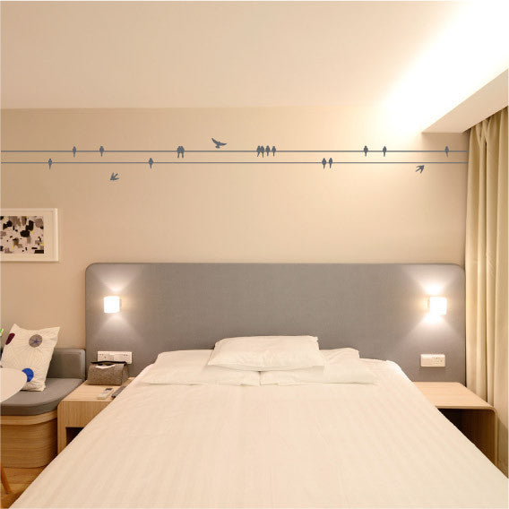 Perched birds on a wire wall sticker design