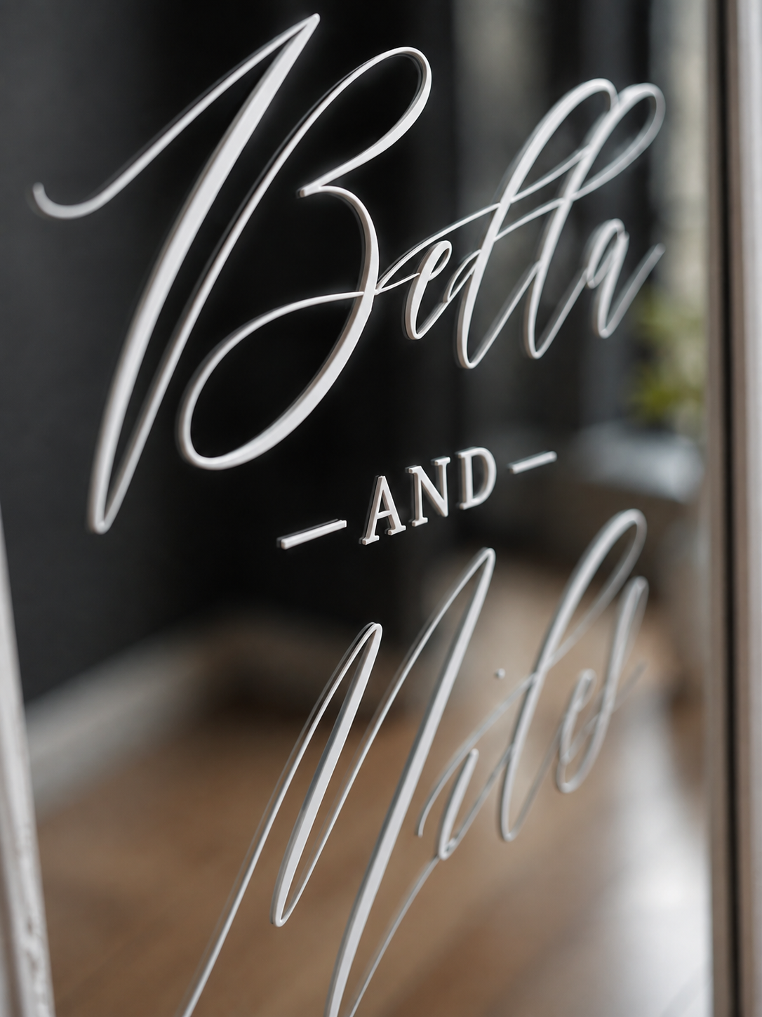 close up of wedding mirror decal on mirror with custom names and date for a personalised wedding welcome sign