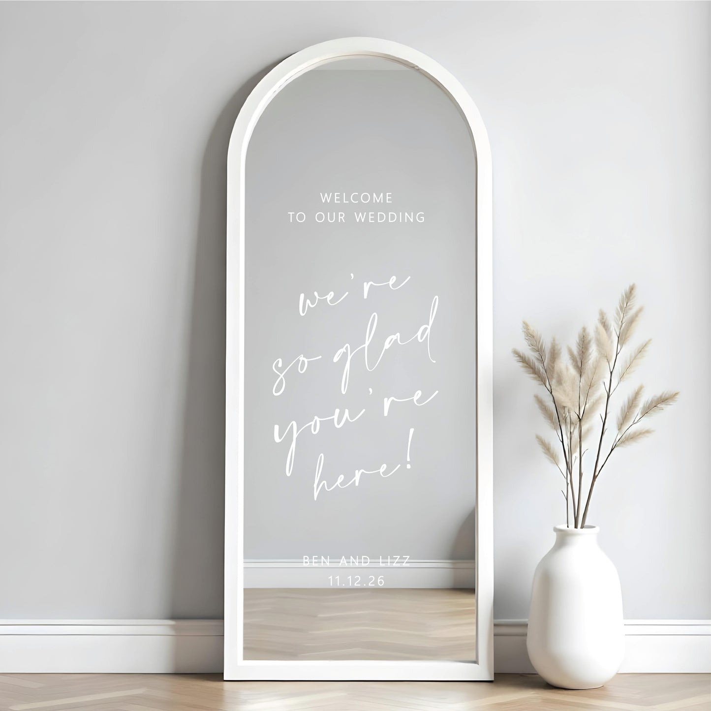 Custom wedding mirror decal on tall arched mirror with personalised names and date for wedding welcome sign