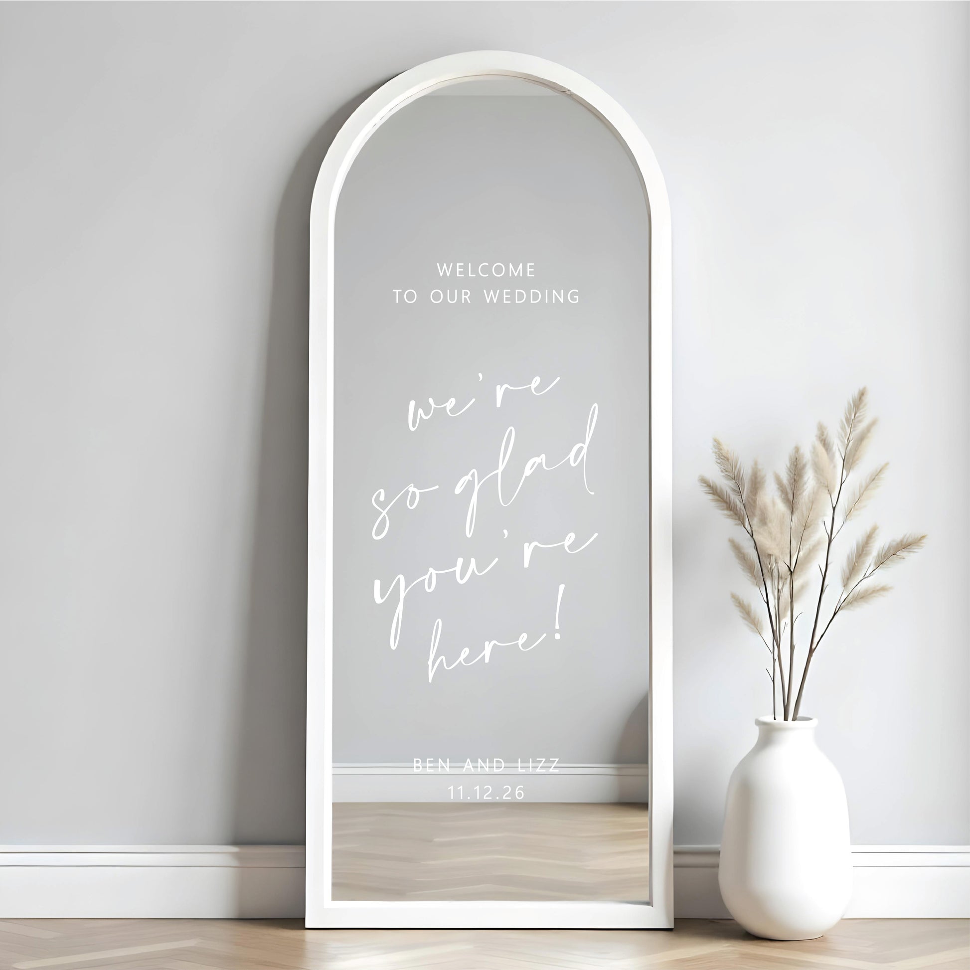 Custom wedding mirror decal on tall arched mirror with personalised names and date for wedding welcome sign