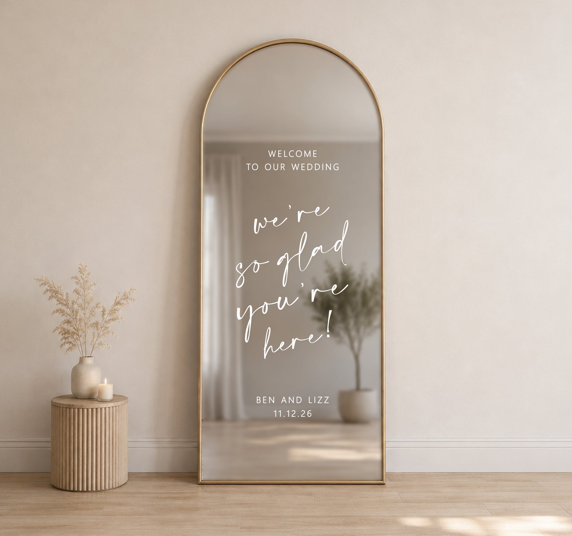 Custom wedding mirror decal on tall arched mirror with personalised names and date for wedding welcome sign