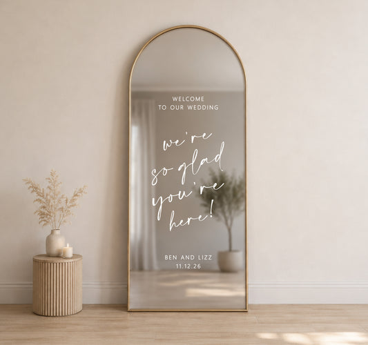 Custom wedding mirror decal on tall arched mirror with personalised names and date for wedding welcome sign