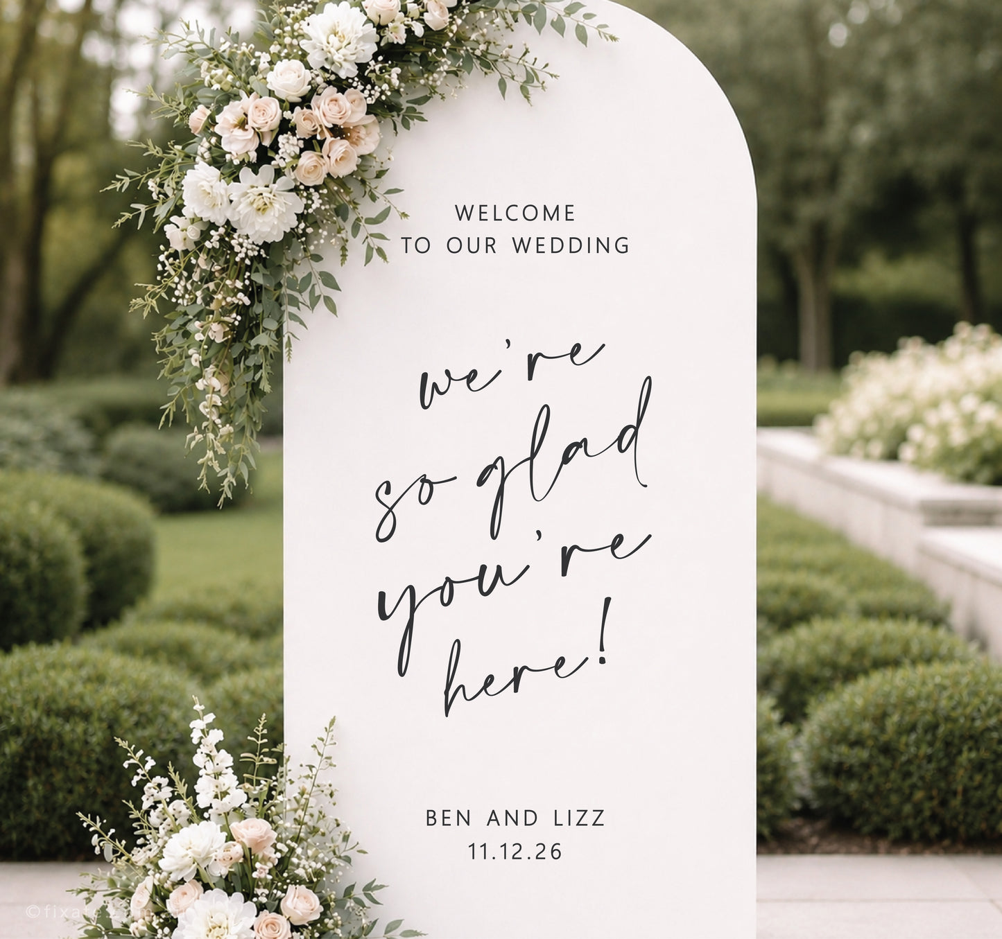 Custom wedding mirror decal on backdrop with personalised names and date for wedding welcome sign