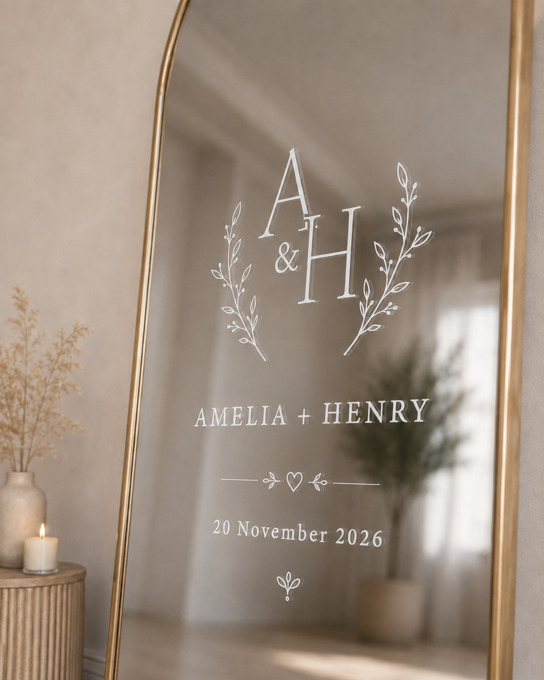 White vinyl wedding mirror sticker with couple initials, names and date on gold framed reception mirror